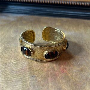Gold Toned hinged Cuff Bracelet with Brown Glass Accents